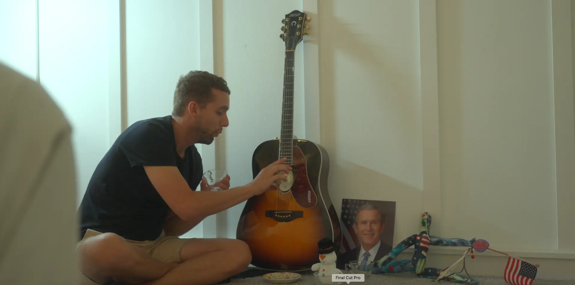 Ben beside his guitar and childhood shrine